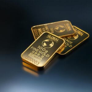 Close-up of gold bars on a dark background, representing wealth and investment opportunities.